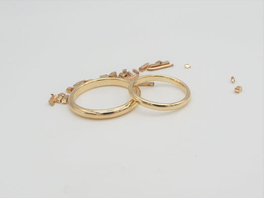 pair of matching handmade wedding rings in 9ct gold